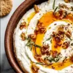 Delicious ricotta dip topped with hot honey served in a bowl