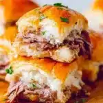 French Dip Sliders served on a platter with dipping sauce