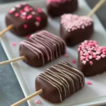 Heart-shaped cake pops arranged on a decorative platter