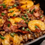 Loaded Ground Beef and Potatoes Skillet with colorful vegetables in a cast iron pan