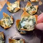 Spinach and artichoke filled wonton cups served as a tasty appetizer