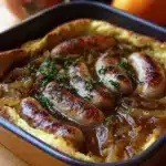 Toad in the Hole served with onion gravy on a plate
