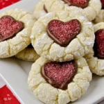 Valentine Crinkle Cookies with chocolate hearts on a decorative plate.