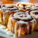 Delicious cinnamon roll French toast topped with cream and cinnamon