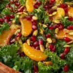 Citrus Pomegranate Kale Salad with fresh ingredients and colorful presentation