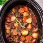Crockpot beef bourguignon recipe featuring tender beef and savory vegetables