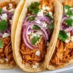 Crockpot Chicken Tacos recipe with fresh ingredients and spices.