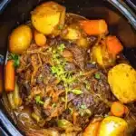 Crockpot French Onion Pot Roast served with onions and herbs