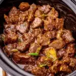 Delicious Crockpot Mississippi Steak Bites served with herbs and spices