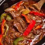 Crockpot pepper steak served with vegetables and rice