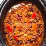 Bowl of Crockpot Root Beer Chili garnished with cilantro