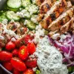 Delicious Greek Chicken Bowl with fresh vegetables and zesty sauce