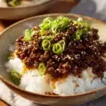 Delicious Ground Beef Hot Honey Bowl garnished with fresh herbs and spices