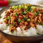 Plate of Honey Garlic Ground Turkey served with vegetables and rice.