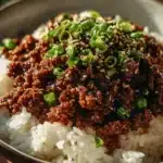 Korean Ground Beef Bowl garnished with vegetables and sesame seeds