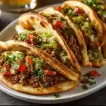 Mediterranean ground beef pita pockets filled with fresh vegetables and herbs