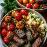Mediterranean steak bowl with grilled vegetables and herbs