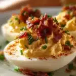 Delicious Million Dollar Bacon Deviled Eggs served on a platter