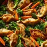 Delicious potsticker stir fry with colorful vegetables in a wok