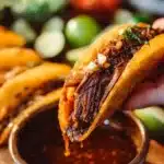 Delicious Slow Cooker Birria Tacos served with fresh toppings