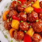 Slow Cooker Hawaiian Meatballs served with pineapple and bell pepper