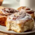 Freshly baked sourdough discard cinnamon rolls topped with icing