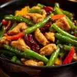 Spicy garlic chicken stir-fry with green beans on a plate
