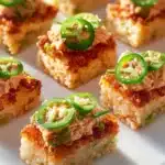 Spicy Tuna Crispy Rice topped with sesame seeds and green onions