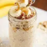 Delicious banana bread overnight oats served in a bowl with sliced bananas on top