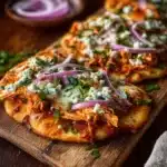 Delicious Buffalo Chicken Flatbread Pizza topped with spicy sauce and cheese
