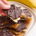 Delicious homemade chocolate banana bark topped with sliced bananas.