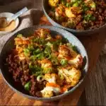 Plate of crispy chile ground beef with cauliflower garnish