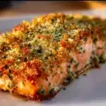 Crispy Parmesan Salmon Bake with a golden crust and fresh herbs