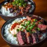 Korean BBQ steak rice bowl topped with spicy cream sauce for a delicious meal