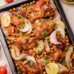 Delicious sheet pan chicken shawarma ready to serve with fresh vegetables.