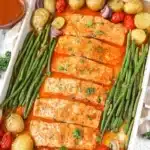 Sheet Pan Salmon with colorful roasted veggies ready to serve
