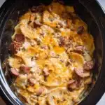Slow cooker scalloped potatoes with kielbasa served in a bowl
