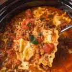 Delicious slow cooker lasagna layered with cheese and marinara sauce