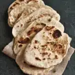 Freshly baked sourdough flatbread showcasing its crispy texture and golden color.