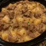 Slow cooker creamy beef tips with potatoes served in a bowl