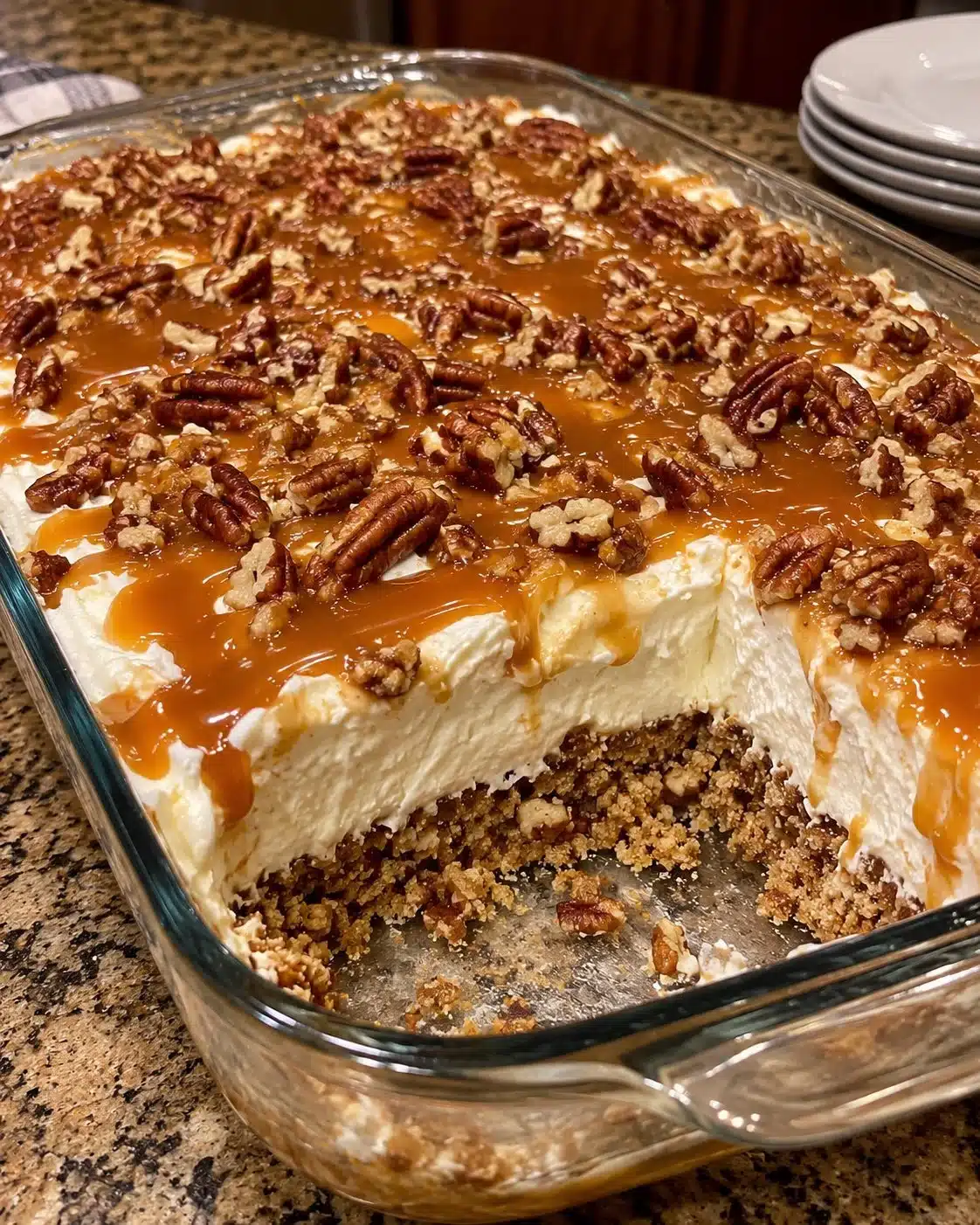 Delicious Pecan Caramel Cream dessert topped with pecans and caramel drizzle